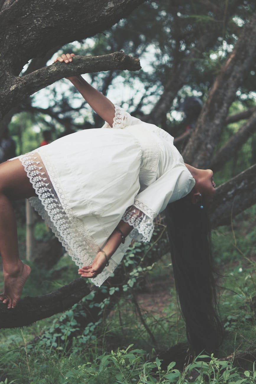 photo of woman wearing white dress